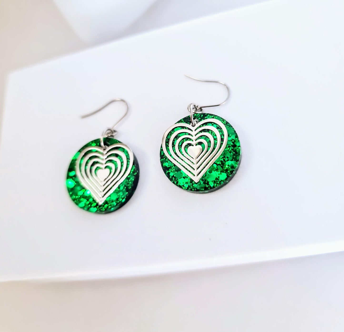 Silver Heart Emerald Green Circle Resin Drop Earrings, Statement Green Glitter Earrings, Stainless Steel Hypoallergenic Earrings.