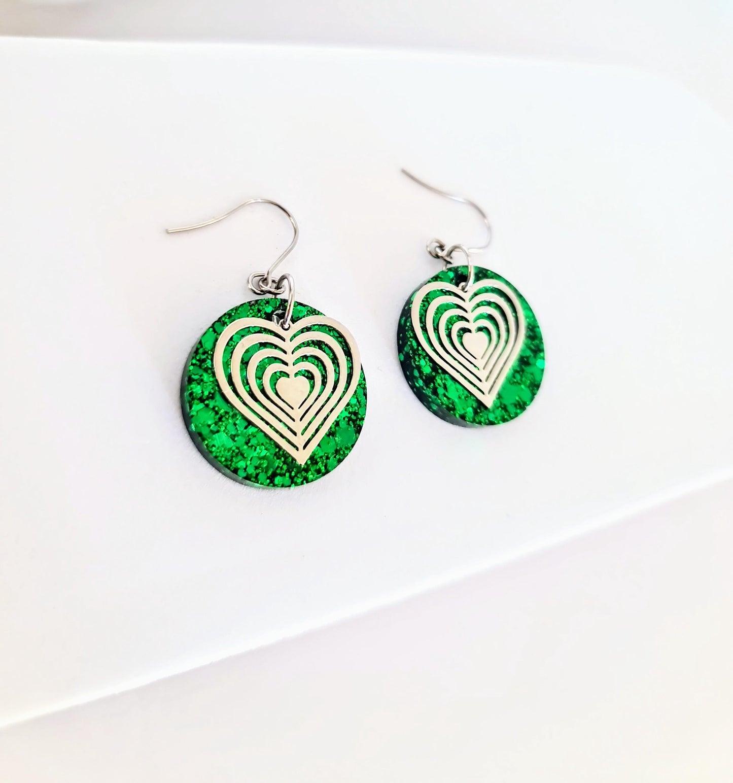 Silver Heart Emerald Green Circle Resin Drop Earrings, Statement Green Glitter Earrings, Stainless Steel Hypoallergenic Earrings.