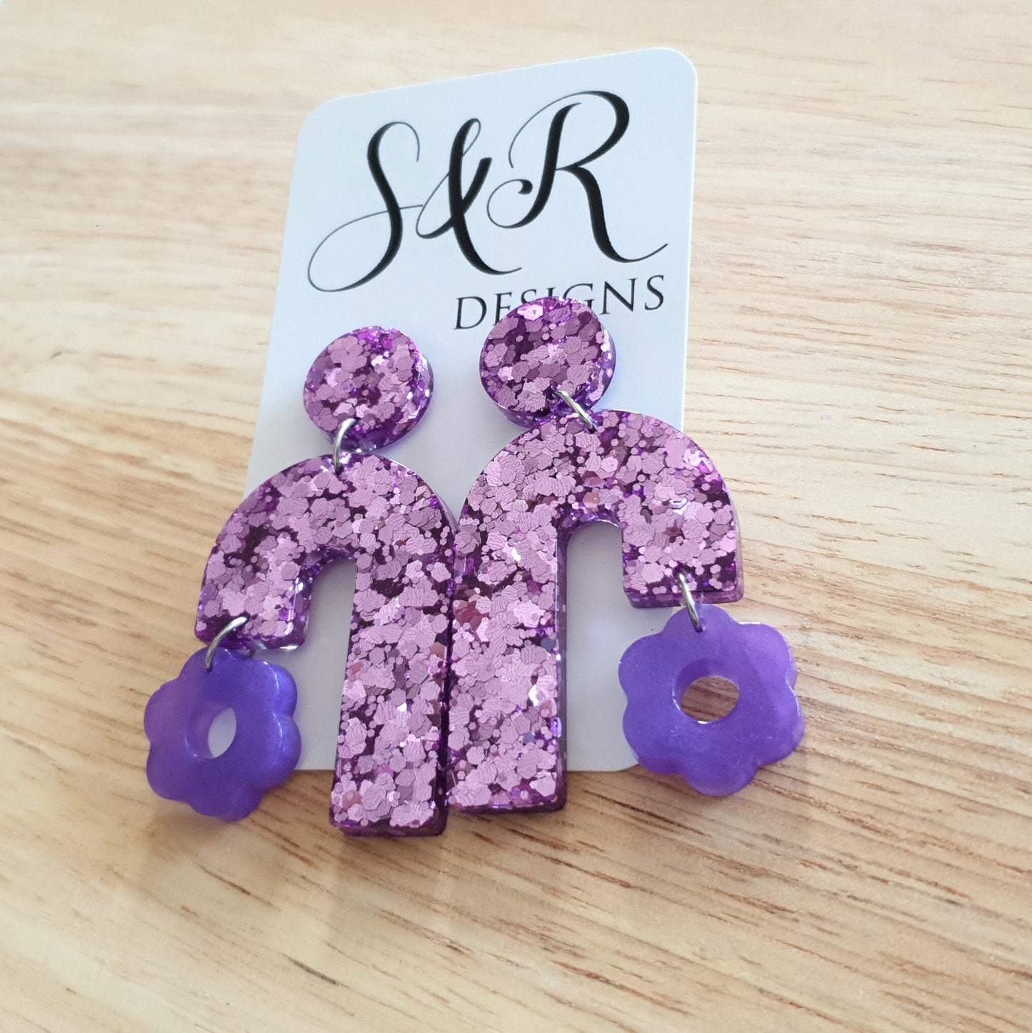 Blush Pink Arch Dangles with Purple Flower, Pink Glitter Resin, Purple Flower Charm, Statement Stainless Steel Earrings