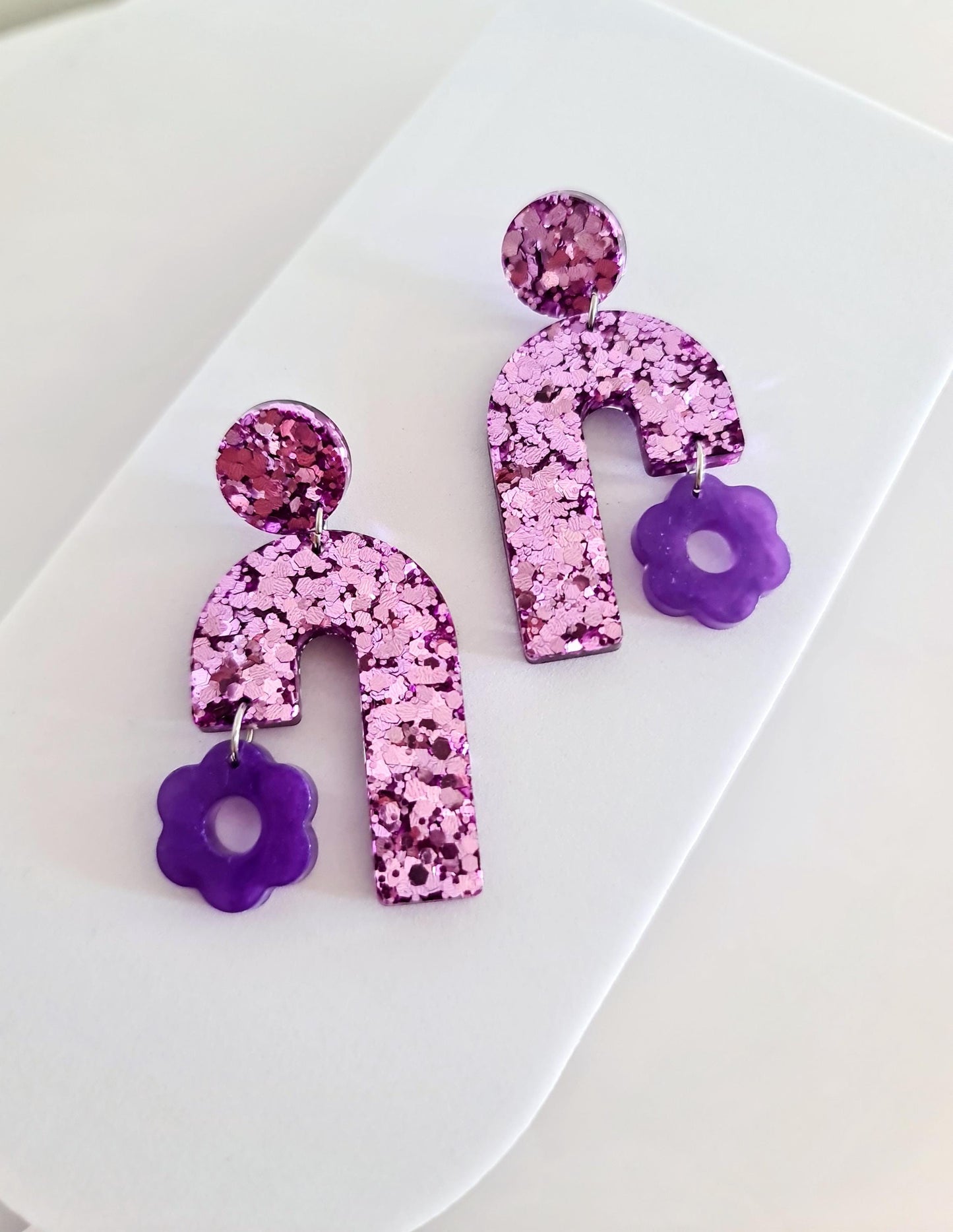Blush Pink Arch Dangles with Purple Flower, Pink Glitter Resin, Purple Flower Charm, Statement Stainless Steel Earrings