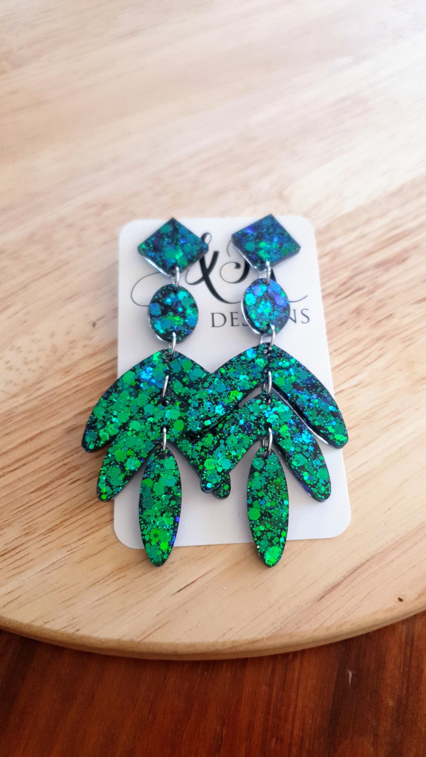Dazzle in these Ocean Green Leaves Long Drop Earrings. Blue-green chameleon changing glitter resin dangles, Stunning Chandelier Statement