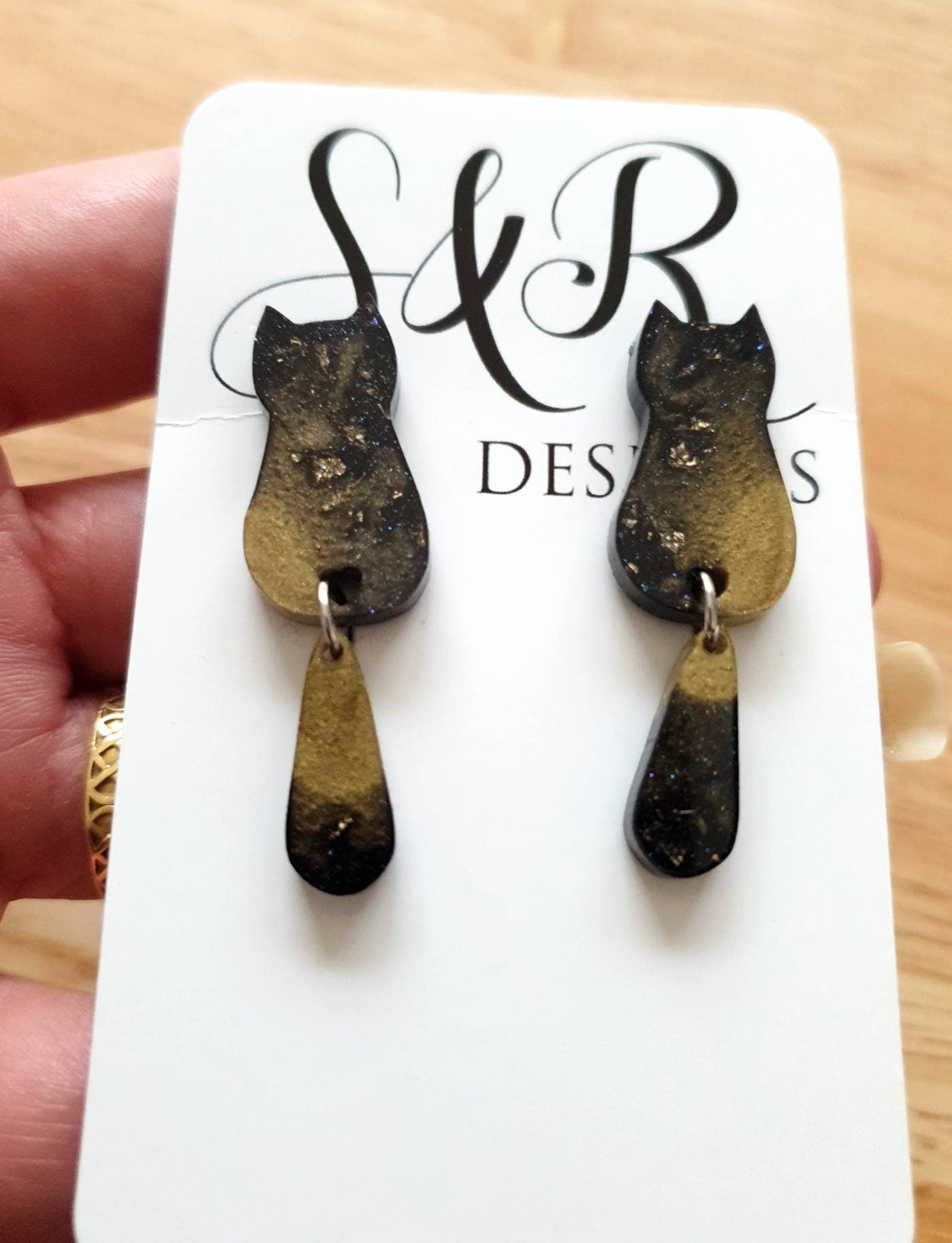 Black Gold Cat Dangle Earrings, Cat with Moving Tail Long Earrings, Black and Gold Leaf Resin Earrings, Cat Earrings Stainless Steel.