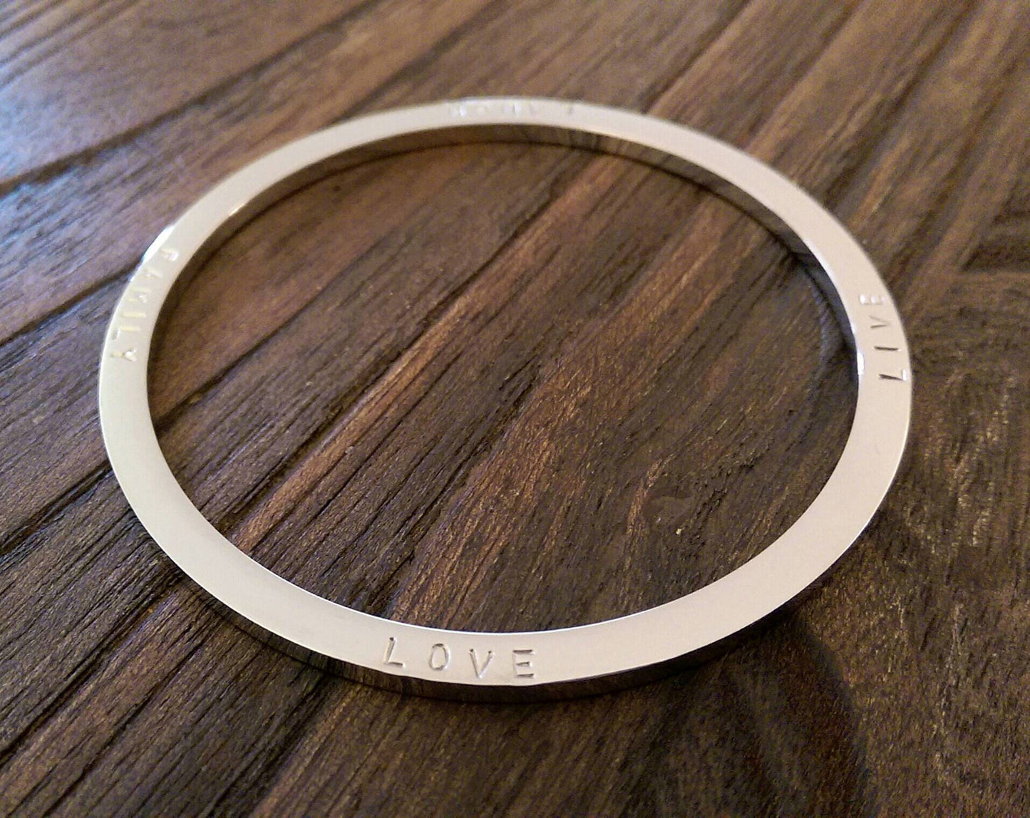 Hand Stamped Bangle Personalised Family Love Laugh Live Bangle Stainless Steel. Ready to post. Size Large 68mm inner diameter.
