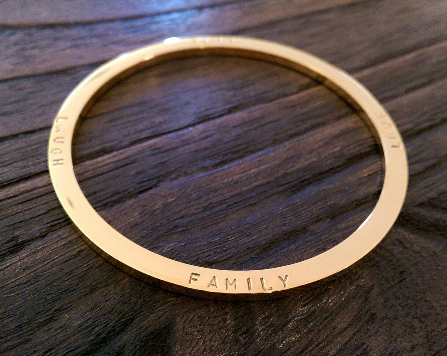 Hand Stamped Bangle Personalised Family Love Laugh Live Bangle Stainless Steel. Ready to post. Size Large 68mm inner diameter.