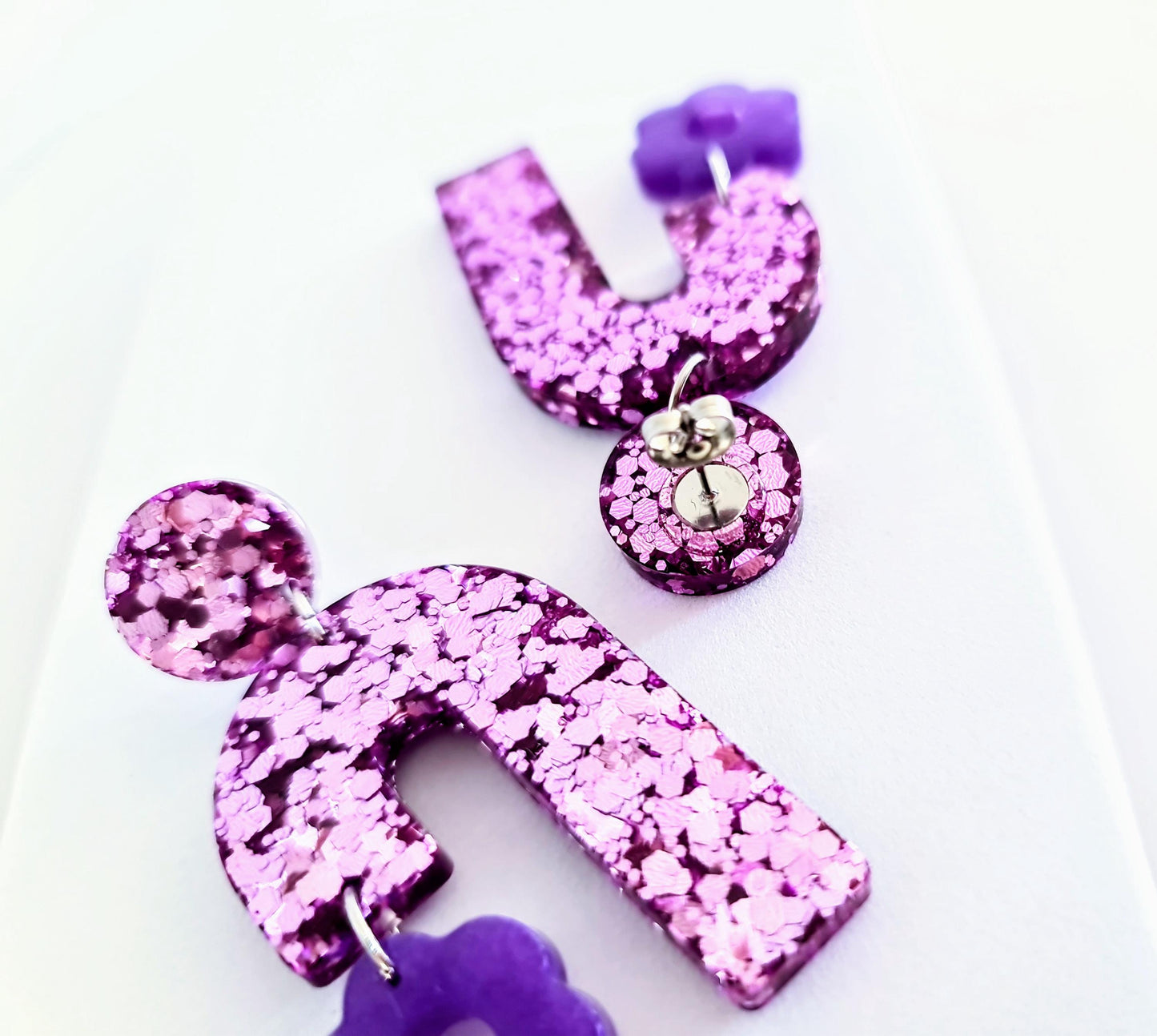 Blush Pink Arch Dangles with Purple Flower, Pink Glitter Resin, Purple Flower Charm, Statement Stainless Steel Earrings