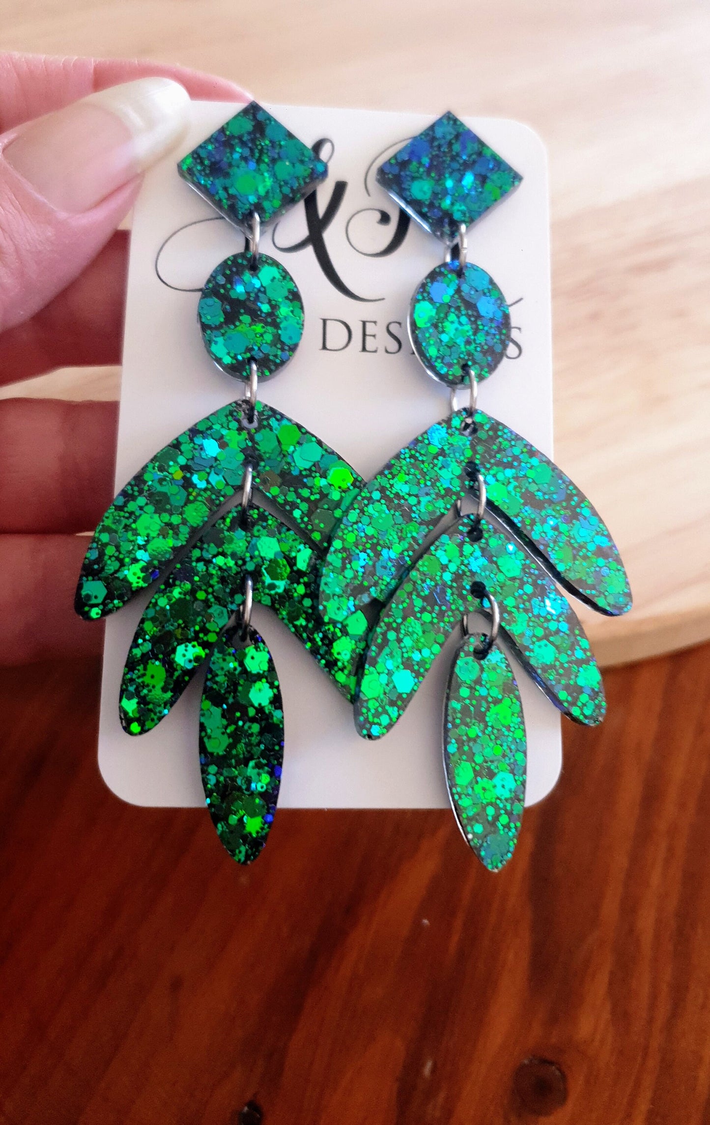 Dazzle in these Ocean Green Leaves Long Drop Earrings. Blue-green chameleon changing glitter resin dangles, Stunning Chandelier Statement