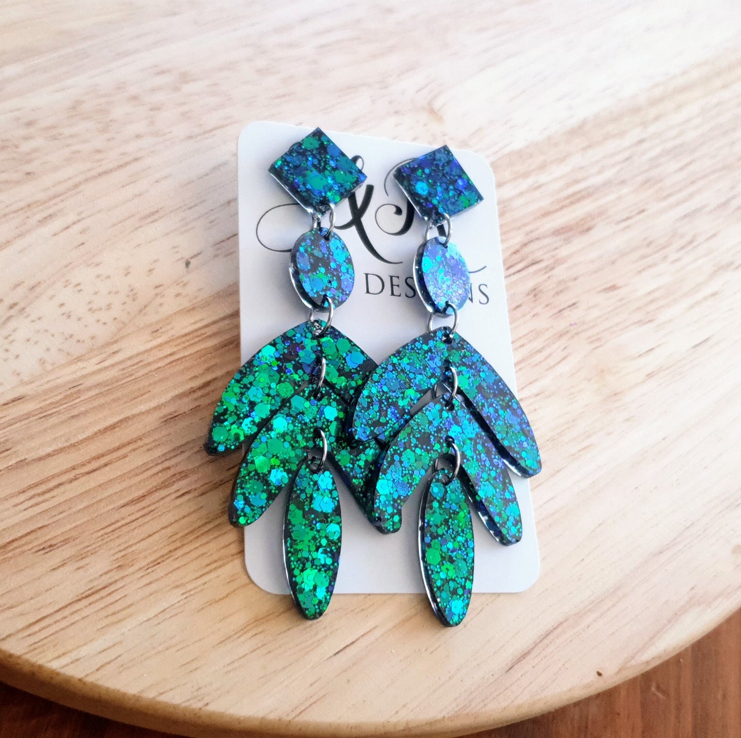 Dazzle in these Ocean Green Leaves Long Drop Earrings. Blue-green chameleon changing glitter resin dangles, Stunning Chandelier Statement