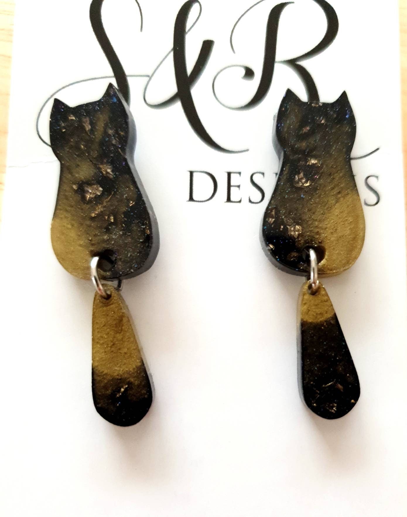 Black Gold Cat Dangle Earrings, Cat with Moving Tail Long Earrings, Black and Gold Leaf Resin Earrings, Cat Earrings Stainless Steel.