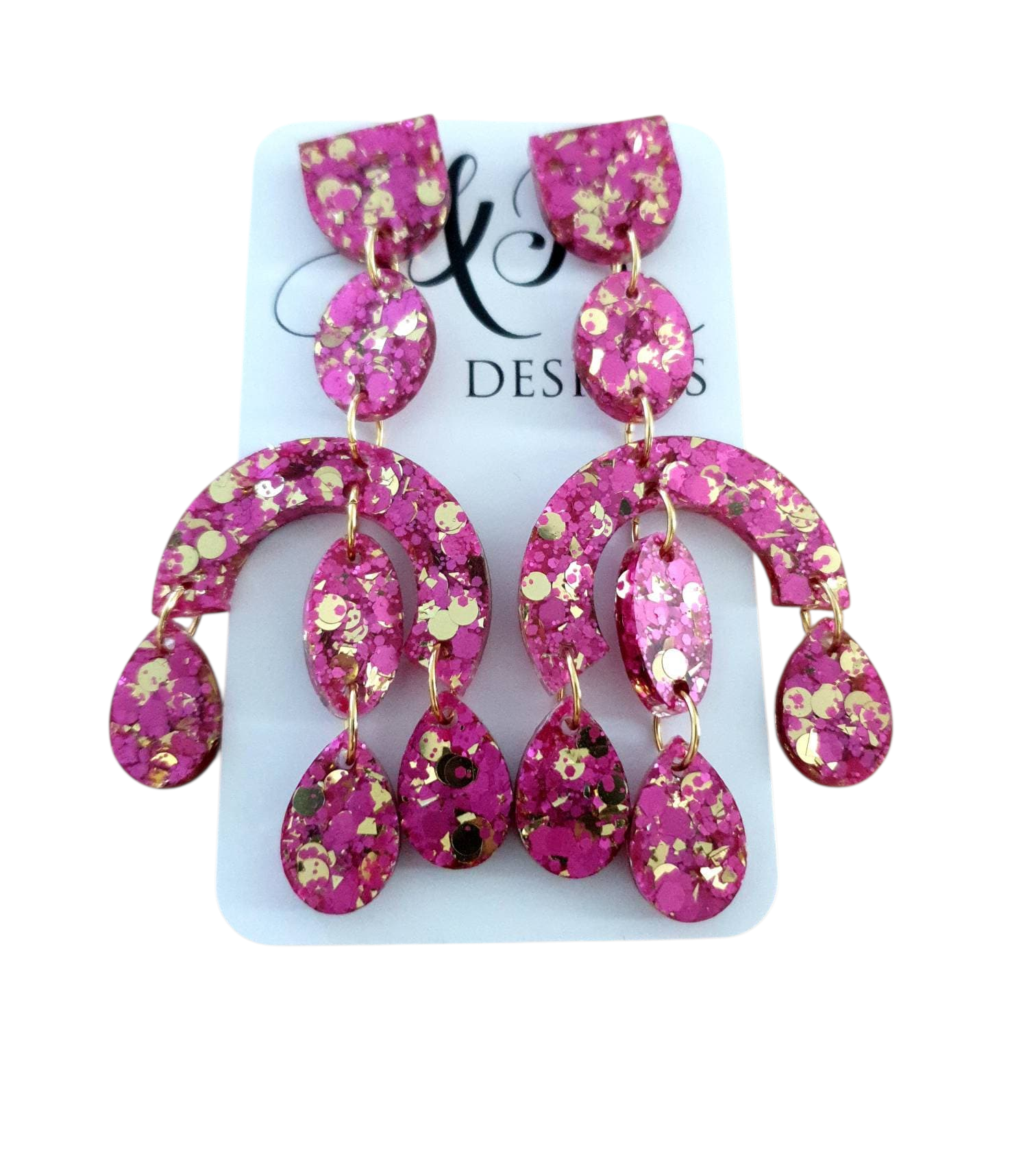 Silver and Resin Designs oversized pink and gold glitter resin chandelier dangle earrings on a display card.