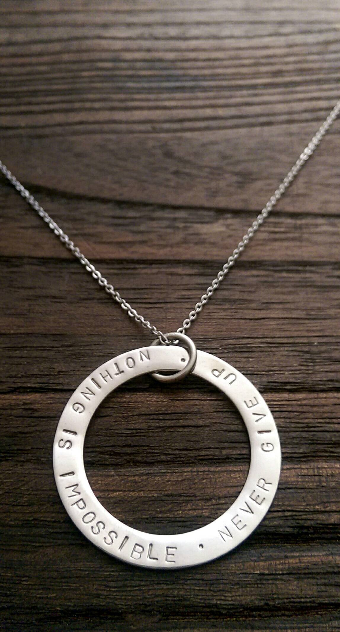 Hand Stamped Circle Necklace "Nothing is impossible . Never Give Up " Ready to post. - Silver and Resin Designs