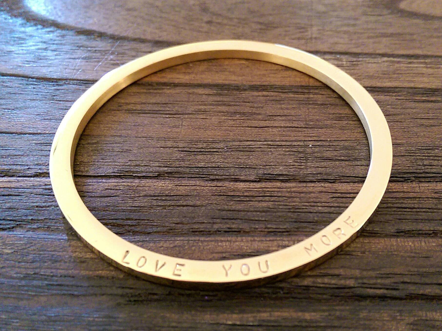 Gold Hand stamped Bangle Personalised Love You More Bangle Stainless Steel. Ready to post. Size Small 62mm inner diameter.