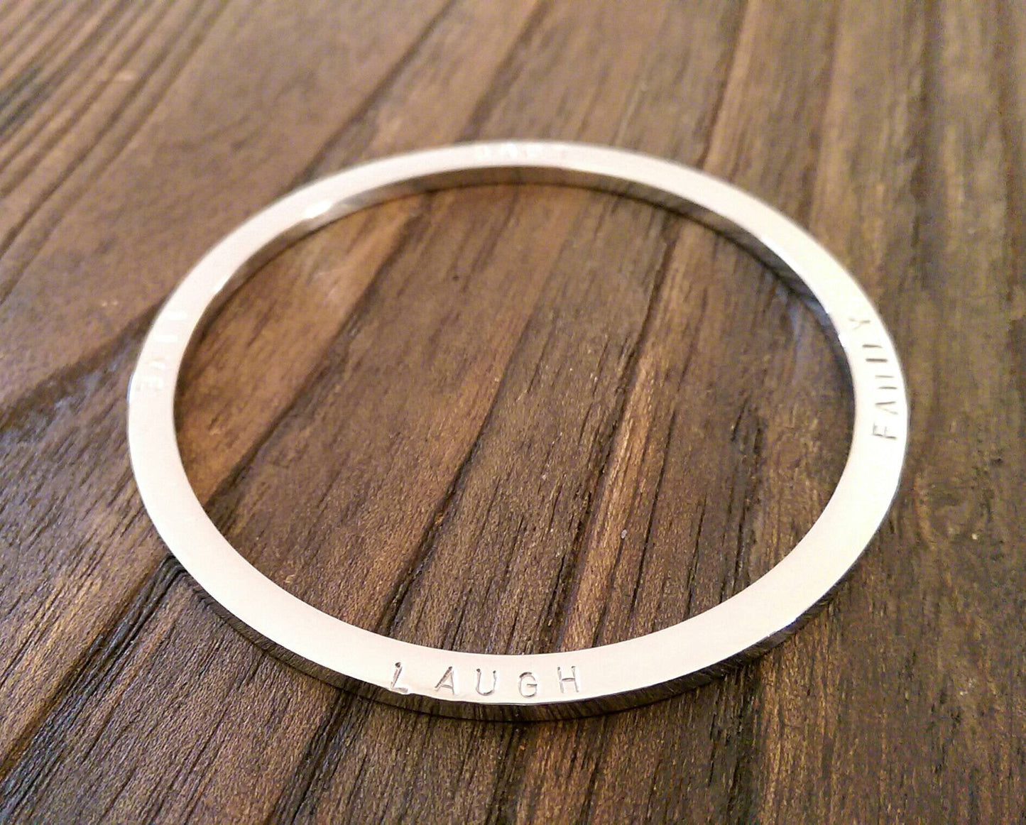 Hand Stamped Bangle Personalised Family Love Laugh Live Bangle Stainless Steel. Ready to post. Size Large 68mm inner diameter.