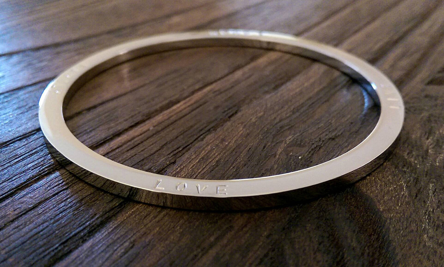 Hand Stamped Bangle Personalised Family Love Laugh Live Bangle Stainless Steel. Ready to post. Size Large 68mm inner diameter.