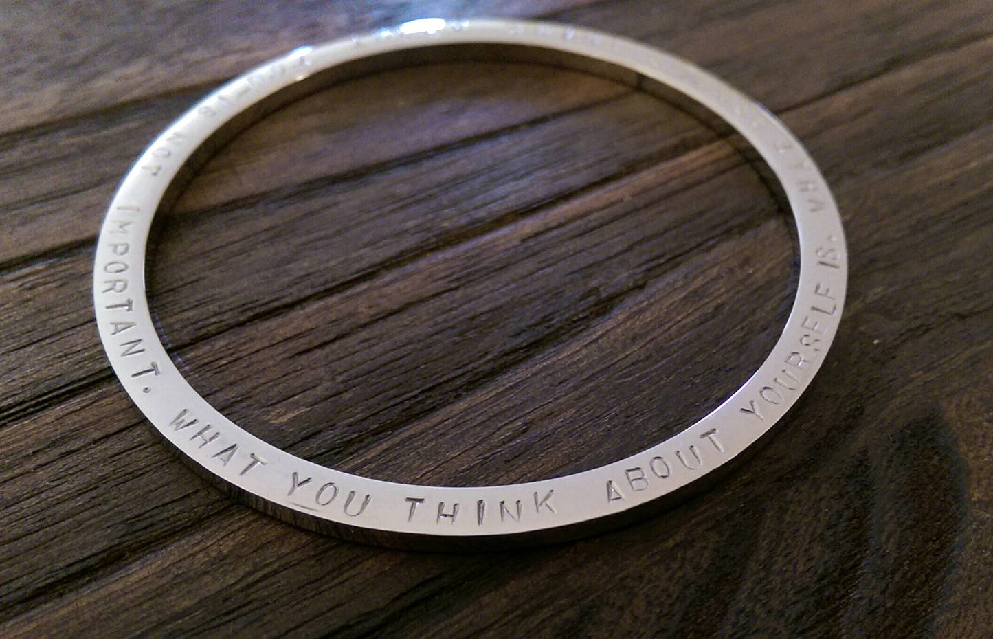 Hand Stamped Bangle What People Think About You Is Not Important, What You Think About Yourself Is Stainless Steel. Ready 2 post. Large 68mm